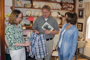 Brad Orton examines the merchandise under the watchful eyes of shop volunteers Lynn Nickerson, left, of Bernardsville, NJ, and Arlene Rafalko of Gillette, NJ.